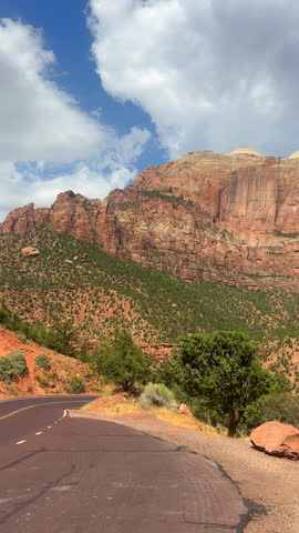 Panning view in vertical format of red rock formation at Zion National Park in Utah, USA.