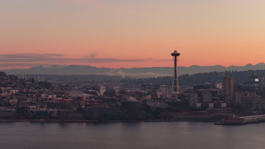 Seattle Space Needle at sunset above downtown skyline and mountains, Washington, USA. g.