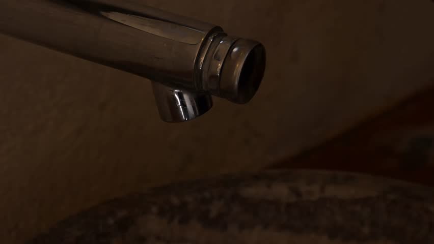 Latina girl washing her hands.