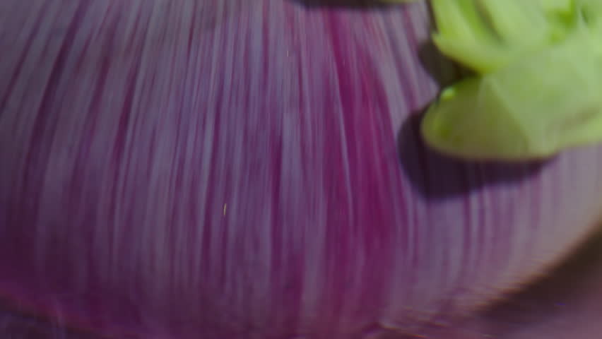 Vapor dye. Defocused swirl. Yellow liquid paint pouring on purple sphere. Art color trickles blend dye emulsion abstract background.