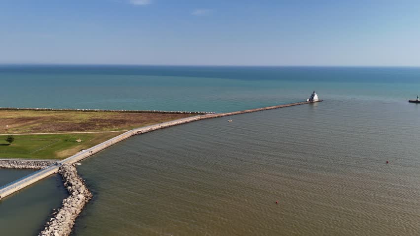 Aerials of Manitowoc Wisconsin USA on bright early fall day.  Drone shot of Breakwater.