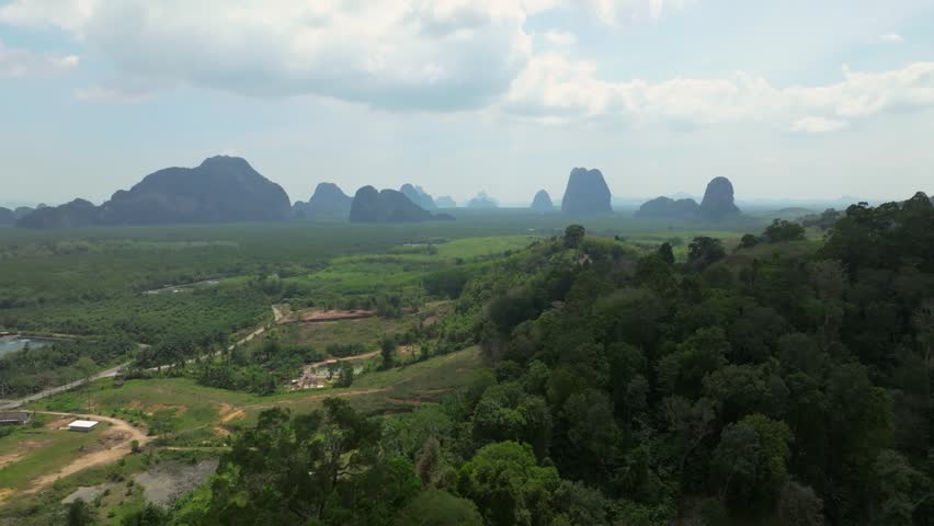 Aerial view of limestone mountains and lush landscape in Thailand
