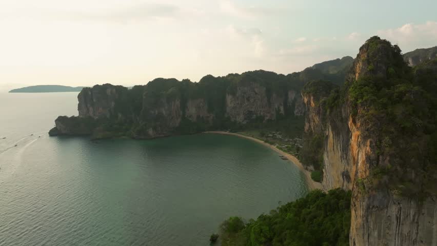 Aerial view of limestone cliffs and tranquil bay in Thailand