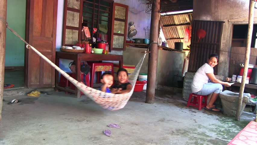 HOI AN, VIETNAM - JULY 2: Asian family resting in their home Hoi An, Vietnam on