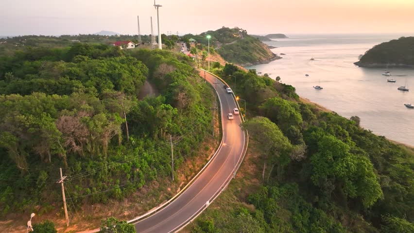Winding coastal road near lush greenery in Thailand