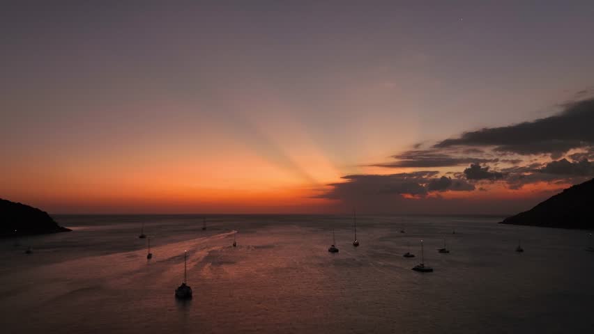 Aerial view of boats anchored near stunning Thailand coastline at dusk
