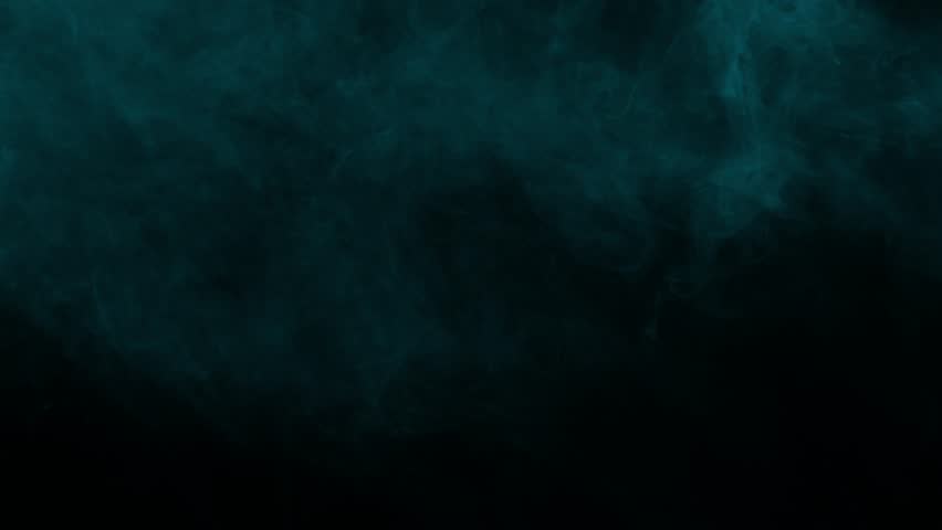 Dense arctic blue smoke cloud slowly swirling in dark environment. Isolated on black background, ideal for compositing, vfx overlay, and creating a moody atmosphere