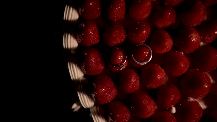 Romantic Wedding Rings Over Chocolate Strawberry Cake