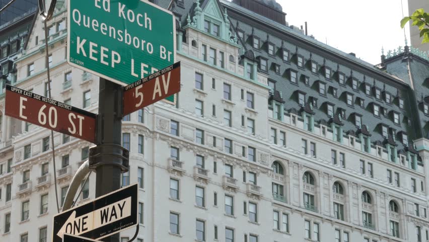 New York City Manhattan Midtown, United States. Old historic hotel building 1907 on Grand Army Plaza, 5 fifth avenue sign near Central Park. Classic iconic american architecture. Pulitzer Plaza in NYC