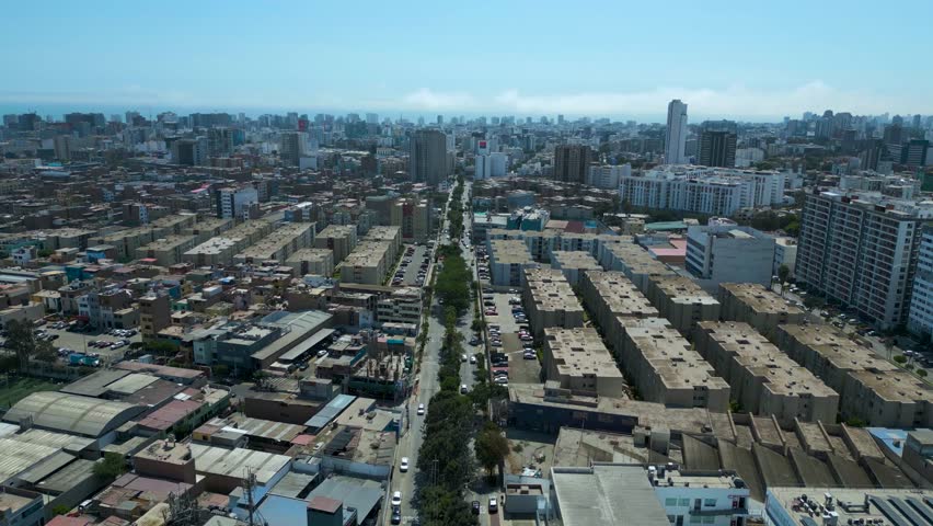 Cinematic aerial panorama of Lima, Peru under bright January summer sun, expansive South American capital in 4K 60fps.