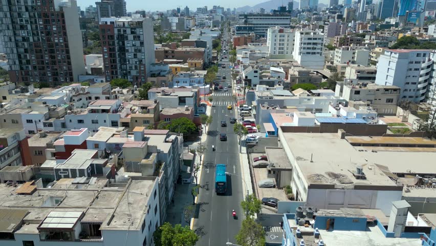 Cinematic aerial traveling over sunny and peaceful tourist streets of Miraflores, Lima, Peru in 4K 60fps drone footage.