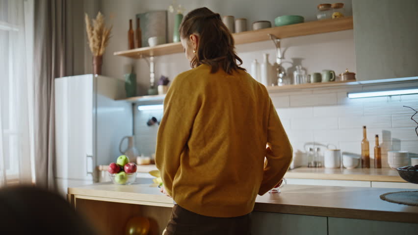 Smiling mother serving breakfast cozy kitchen closeup. Friendly people relatives enjoying morning weekend together. Carefree dad kids sitting dining table eating tasty food. Happy family sunny home