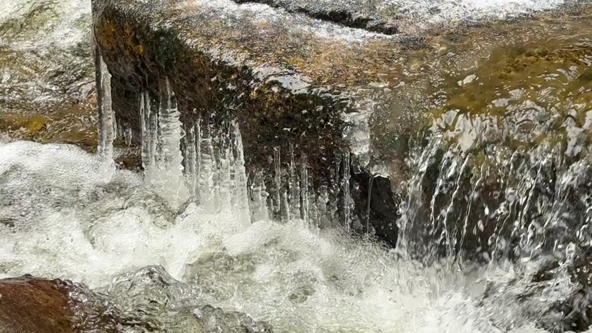 Mountain rocky river in winter forest