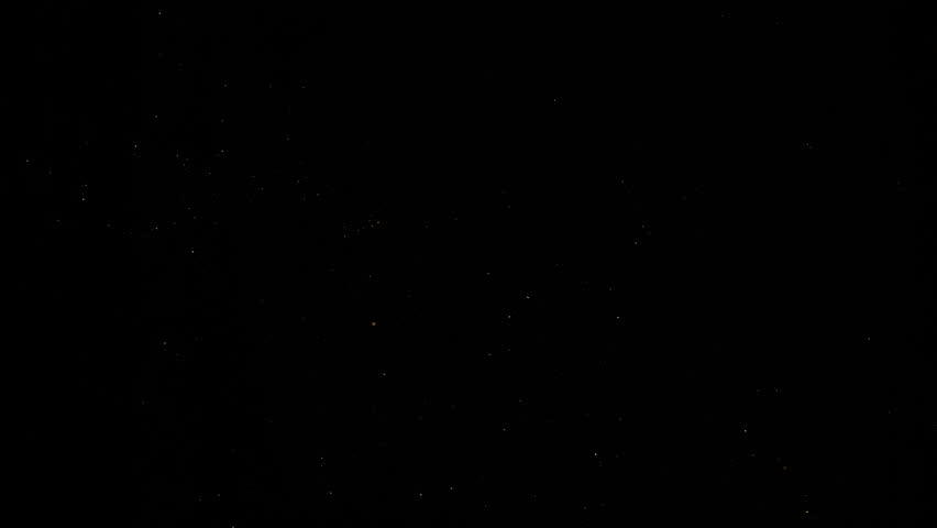 Super Slow Motion Shot of Golden Glitters on Black Background at 1000fps.