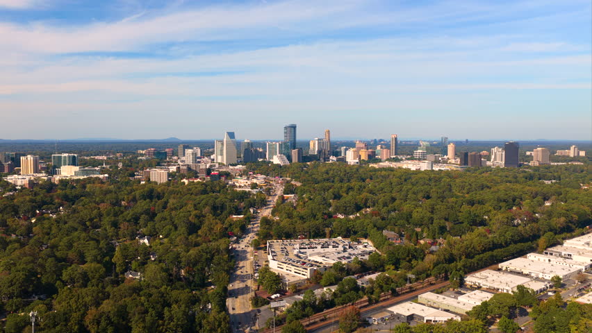 Aerial view of Buckhead downtown city landscape in Atlanta with skyscraper buildings. Urban growth, transportation infrastructure and modern American metropolis.