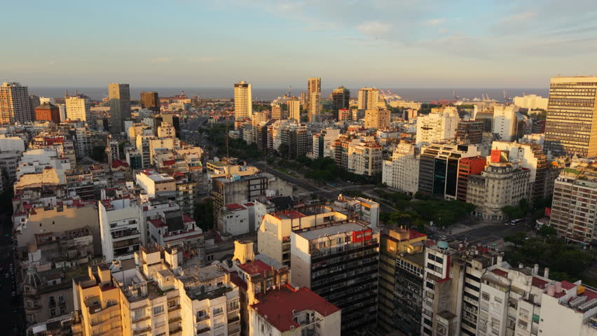 Dense Cityscape And Avenida 9 de Julio At Sunset In Buenos Aires, Argentina. Aerial Drone Shot