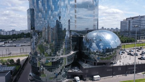 Aerial Rise along Unusual Office Facade