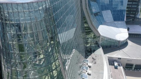 Aerial Descent by Modern Office Facade