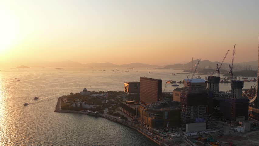 Aerial view of hong kong harbor construction at sunset