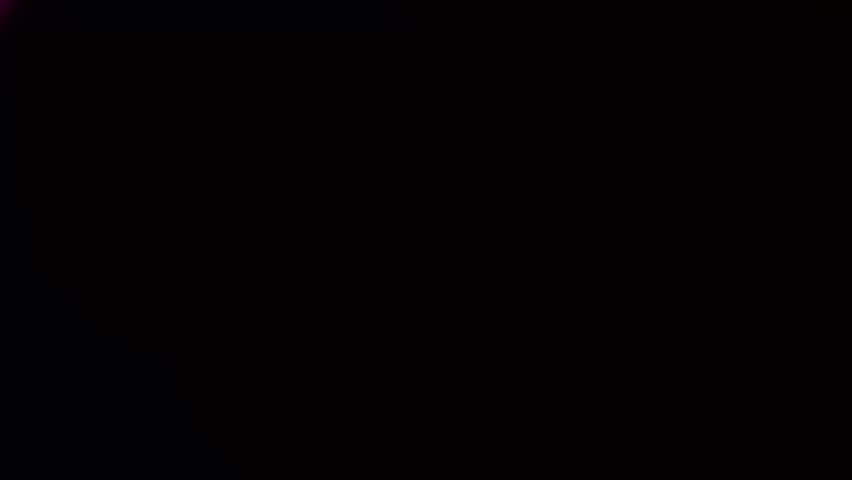 4k Blurred iridescent light leak - chromatic flare on dark background. Retro vintage style transition effect, cinematic overlay, prism texture. Festive intros, wedding, vlog, music video design