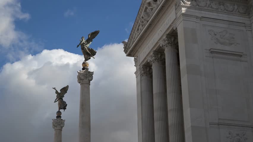 Intricate gold and colorful mosaic tiles decorating the vaulted internal ceilings of the portico at the Altare della Patria monument featuring allegorical Italian symbols