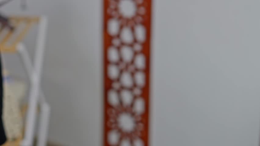 Close-up of Hands receiving zakat Al-Fitr with cash money at mosque