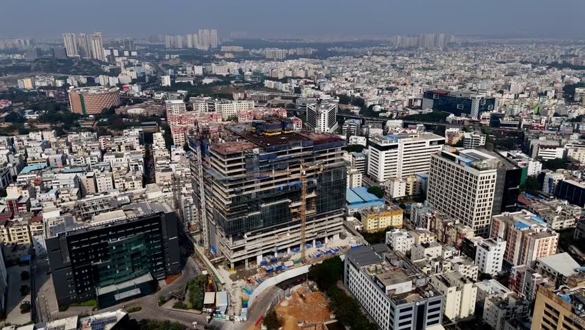 Skyline in progress—high-rise construction reshapes Hyderabad’s urban core, where cranes, glass facades, and concrete frames signal rapid growth.