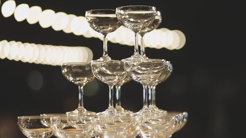 A lot of glasses of champagne in a luxurious atmosphere. Stylish, toned photo. Secular reception, new year, wedding