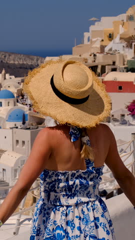 Woman beautiful in Greece Santorini. Selective focus.