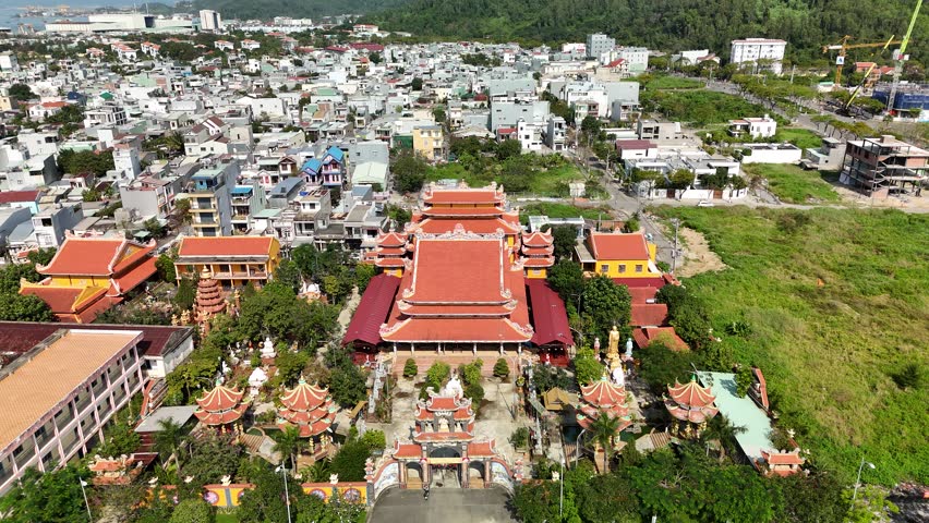 Buu Dai Son Pagoda, Da Nang, Vietnam – 4K aerial drone footage of Buddhist temple, coastal town, Son Tra Beach, green mountain backdrop