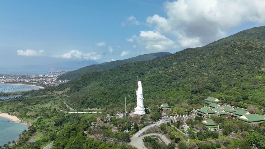 Linh Ung Pagoda, Son Tra Peninsula, Da Nang (Danang), Vietnam – 4K aerial drone footage of Buddhist temple, Lady Buddha statue, coastal mountains and tropical bay