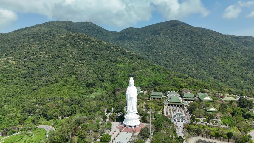 Linh Ung Pagoda, Son Tra Peninsula, Da Nang (Danang), Vietnam – 4K aerial drone footage of Buddhist temple, Lady Buddha statue, coastal mountains and tropical bay