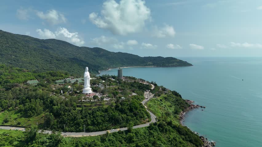 Linh Ung Pagoda, Son Tra Peninsula, Da Nang (Danang), Vietnam – 4K aerial drone footage of Buddhist temple, Lady Buddha statue, coastal mountains and tropical bay