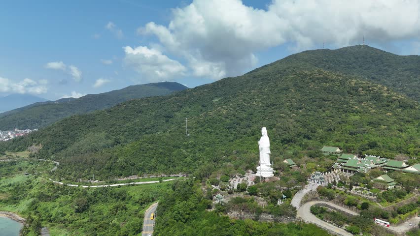 Linh Ung Pagoda, Son Tra Peninsula, Da Nang (Danang), Vietnam – 4K aerial drone footage of Buddhist temple, Lady Buddha statue, coastal mountains and tropical bay