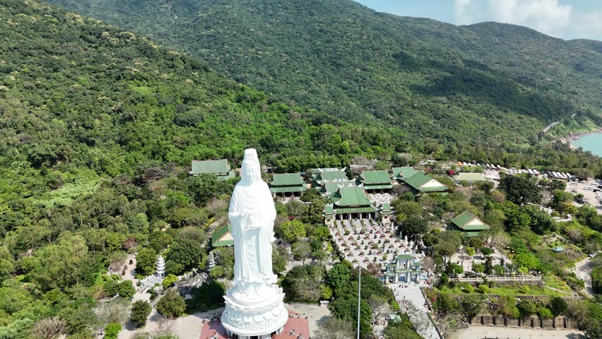 Linh Ung Pagoda, Son Tra Peninsula, Da Nang (Danang), Vietnam – 4K aerial drone footage of Buddhist temple, Lady Buddha statue, coastal mountains and tropical bay