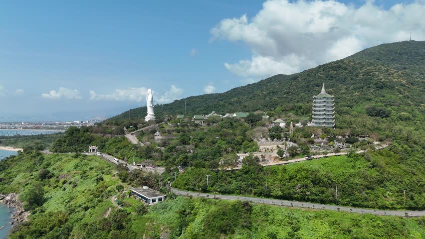 Linh Ung Pagoda, Son Tra Peninsula, Da Nang (Danang), Vietnam – 4K aerial drone footage of Buddhist temple, Lady Buddha statue, coastal mountains and tropical bay