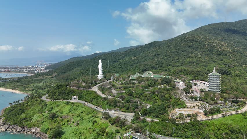 Linh Ung Pagoda, Son Tra Peninsula, Da Nang (Danang), Vietnam – 4K aerial drone footage of Buddhist temple, Lady Buddha statue, coastal mountains and tropical bay