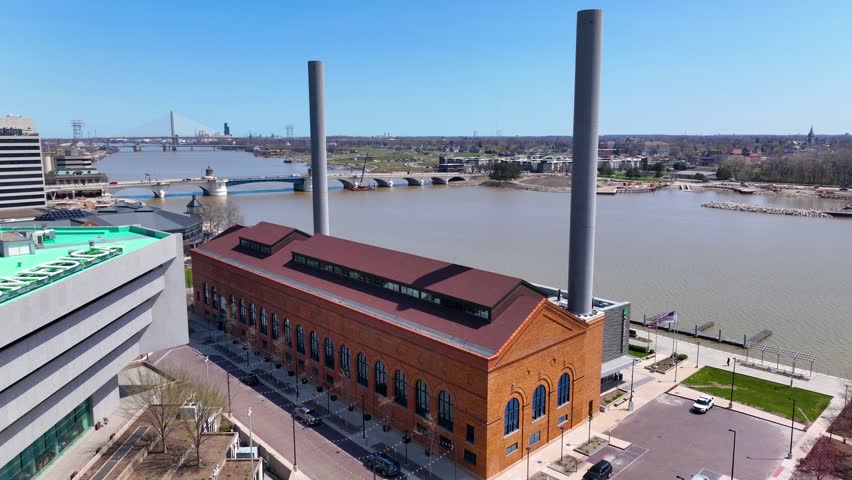 Water Street Station Steam Plant building at the Promenade Park, with Dr. Martin Luther King Jr. Memorial Bridge at the back on Maumee River, city of Toledo, Ohio OH, USA. 