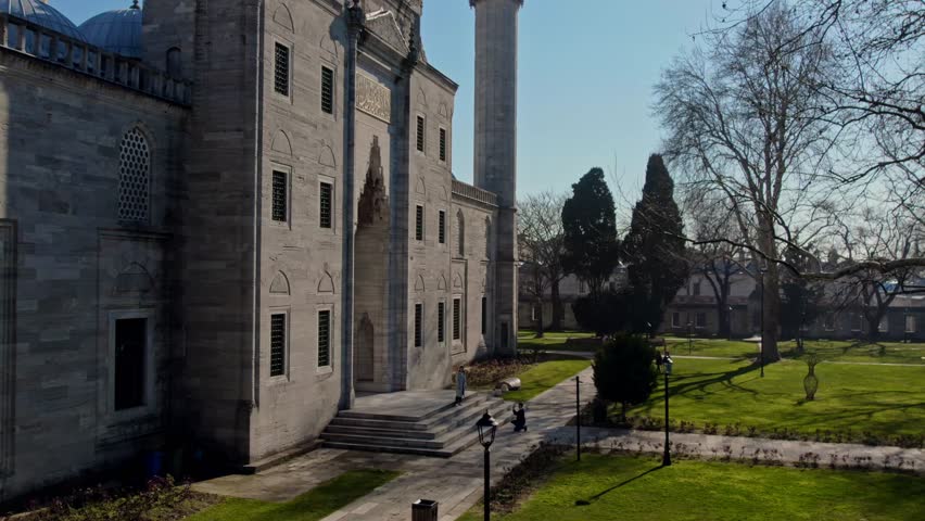 Aerial view highlighting the stone façade, domes, and minaret of the Suleymaniye Mosque in Istanbul. Designed by Mimar Sinan, this iconic mosque represents the pinnacle of Ottoman architecture.