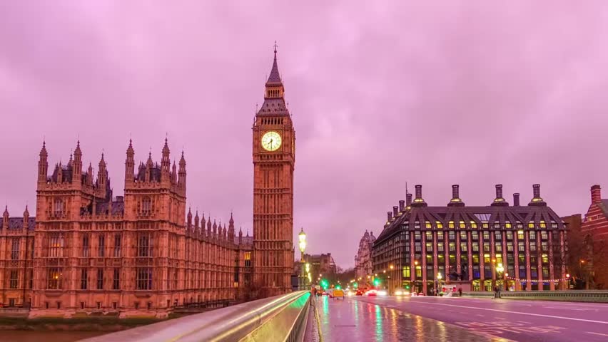 Timelapse of Big Ben and Houses of Parliament at dusk, with light trails highlighting busy streets and iconic architecture.