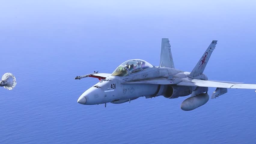 U.S. Navy FA-18 Super Hornet Conducting Midair Refueling Over Calm Open Ocean Waters