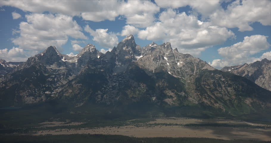 Aerial summer footage of the Cathedral Group of the Teton Range in Grand Teton National Park, Wyoming. T