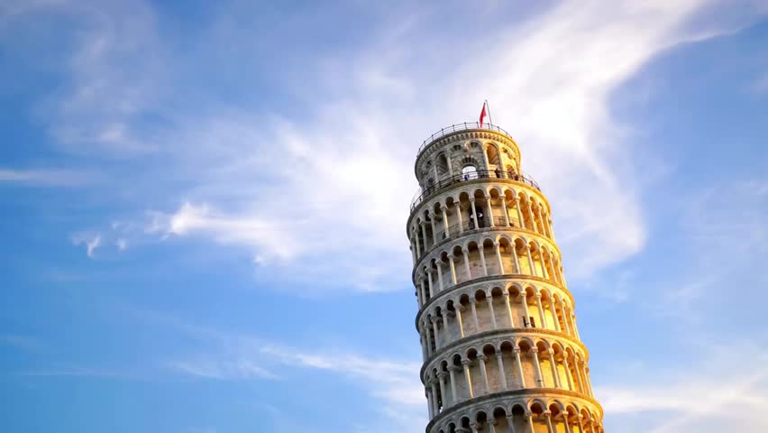 The Leaning Tower of Pisa stands tall against a bright blue sky with wispy clouds, showcasing iconic architecture and Italian cultural heritage.