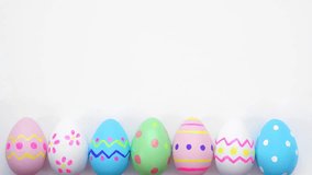 Colorful Easter Egg bottom border on a white background. Stop motion. Copy space. - Powered by Shutterstock - Get 15% off with code: PIKWIZARD15
