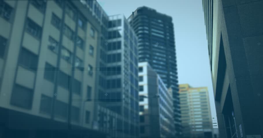 Commercial building in city being processed by data over cityscape.