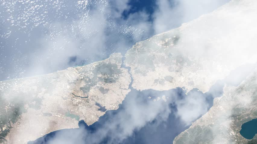 Flying over Istanbul and Bosporus Strait view from space satellite view with passing clouds based on Nasa imagery