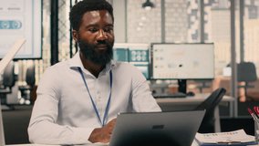 Black man worker, monetary data, performance review, laptop screen, corporate workspace, analytics dashboard, resource allocation, productivity, global business success. Business intel. - Powered by Shutterstock - Get 15% off with code: PIKWIZARD15