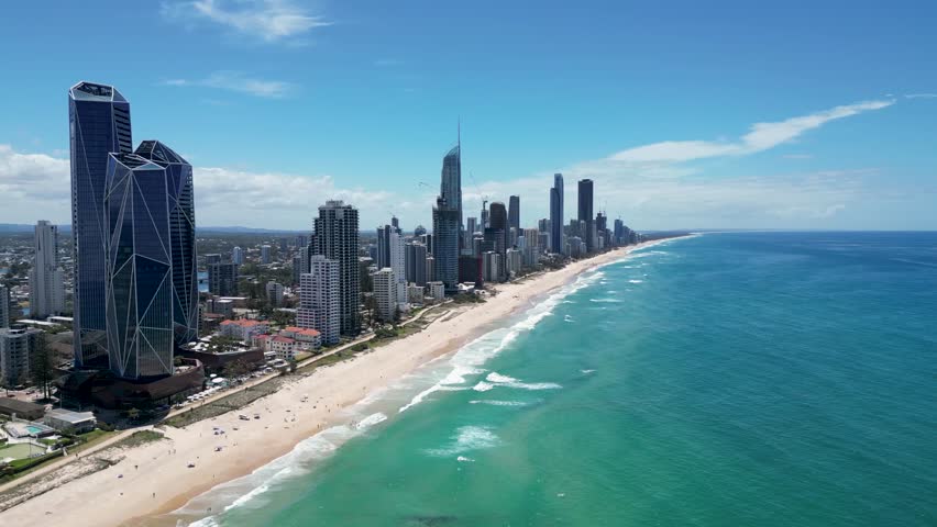 Fly over drone video of the beautiful beach and skyline at Surfers Paradise, Gold Coast, Australia. Queensland.