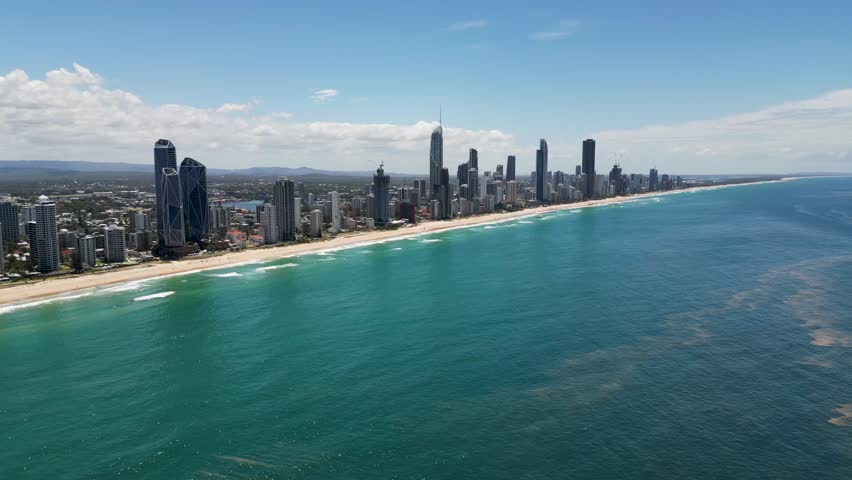 Far out aerial drone video of the beachfront landscape at Surfers Paradise, Gold Coast, Australia.