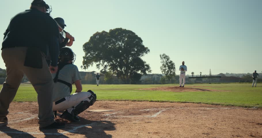 After receiving ball, male players completing pitch cycle at home plate with mitt, bat, copy space. Athletics, sport, competition, action, outdoor, dynamic, teamwork